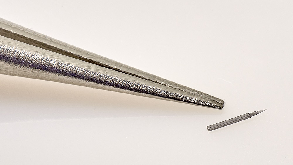 Micro molded medical device with thin wall, micro features, and needle tip