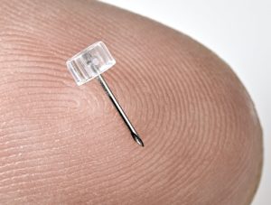 Photo of Micro Hole Needle For Diabetes Drug Delivery, shown on finger tip, by Isometric Micro Molding